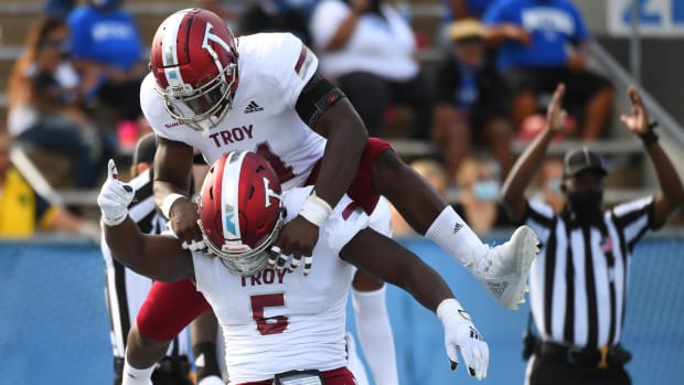 Sep 19, 2020; Murfreesboro, Tennessee, USA; Troy Trojans defensive tackle Will Choloh (5) and Troy Trojans linebacker Javon Solomon (41) celebrate after a safety during the first half against the Middle Tennessee Blue Raiders at Floyd Stadium.