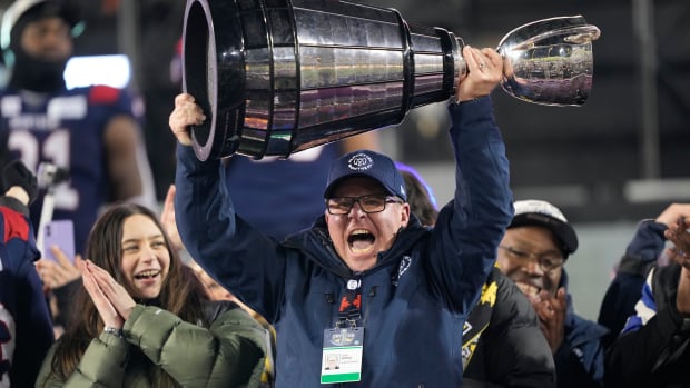 Nov 19, 2023; Hamilton, Ontario, CAN; Montreal Alouettes general manager Danny Maciocia hoists the Grey Cup after winning the 110th Grey Cup against the Winnipeg Blue Bombers at Tim Hortons Field. Mandatory Credit: John E. Sokolowski-USA TODAY Sports  