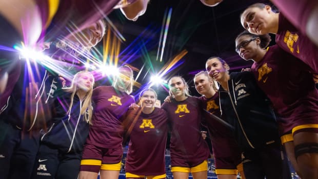 The Gophers huddle before their win over Michigan.