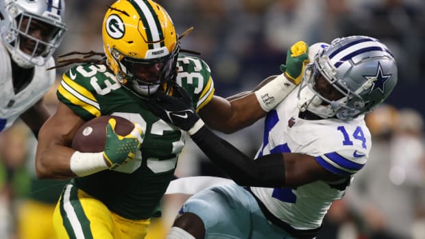 Jan 14, 2024; Arlington, Texas, USA; Green Bay Packers running back Aaron Jones (33) reacts after scoring a touchdown against the Dallas Cowboys during the first quarter for the 2024 NFC wild card game at AT&T Stadium. Mandatory Credit: Kevin Jairaj-USA TODAY Sports  