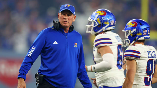 Dec 26, 2023; Phoenix, AZ, USA; Kansas Jayhawks head coach Lance Leipold looks on during the first quarter against the UNLV Rebels in the Guaranteed Rate Bowl at Chase Field. Mandatory Credit: Mark J. Rebilas-USA TODAY Sports  