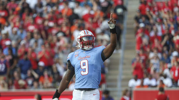 Sep 2, 2023; Houston, Texas, USA; Houston Cougars defensive lineman Nelson Ceaser (9) reacts after a play during the first quarter against the UTSA Roadrunners at TDECU Stadium.