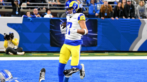 Jan 14, 2024; Detroit, Michigan, USA; Los Angeles Rams wide receiver Puka Nacua (17) scores a touchdown against Detroit Lions cornerback Cameron Sutton (1) during the first half of a 2024 NFC wild card game at Ford Field. Mandatory Credit: Lon Horwedel-USA TODAY Sports  
