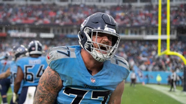 Tennessee Titans offensive tackle Taylor Lewan (77) celebrates as they defeat the Miami Dolphins 34 to 3 at Nissan Stadium Sunday, Jan. 2, 2022 in Nashville, Tenn. Nas Titans Dolphins