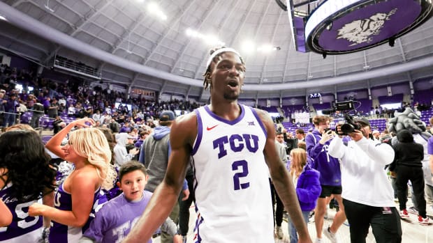 Jan 13, 2024; Fort Worth, Texas, USA; TCU Horned Frogs forward Emanuel Miller (2) celebrates with fans after the game against the Houston Cougars at Ed and Rae Schollmaier Arena. Mandatory Credit: Kevin Jairaj-USA TODAY Sports  