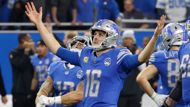 Jared Goff lifts both hands up to the sky as the Lions beat the Rams in a wild-card playoff game.