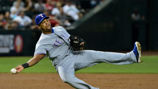 Texas Rangers third baseman Adrian Beltre (29) fields a ball and throws to first base during the first inning against the Arizona Diamondbacks at Chase Field.