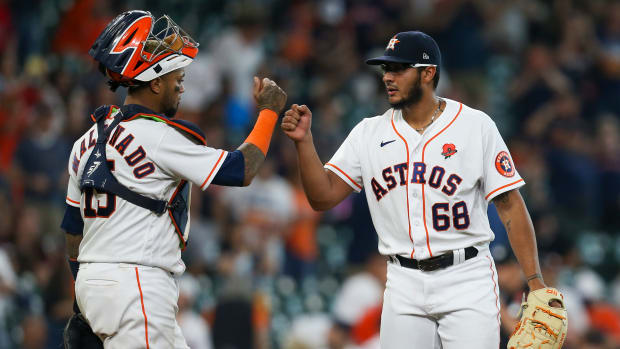 May 31, 2021; Houston, Texas, USA; Houston Astros catcher Martin Maldonado (15) celebrates with relief pitcher Nivaldo Rodriguez (68) after defeating the Boston Red Sox at Minute Maid Park.