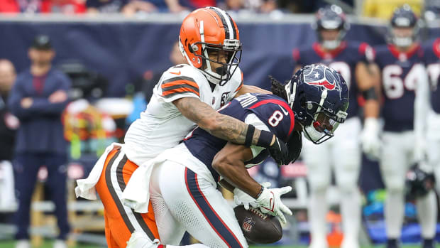 Cleveland Browns cornerback Greg Newsome II (0) defends as Houston Texans wide receiver John Metchie III (8) attempts to make a reception during the third quarter at NRG Stadium.