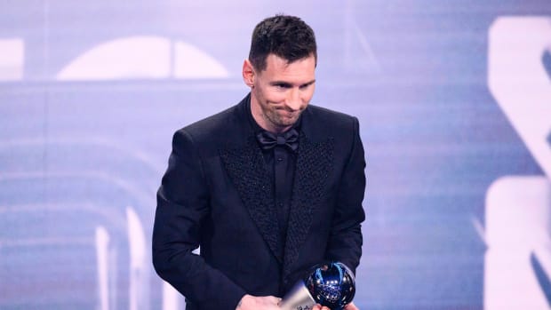 Lionel Messi pictured holding his trophy after winning The Best FIFA Men's Player award for 2022