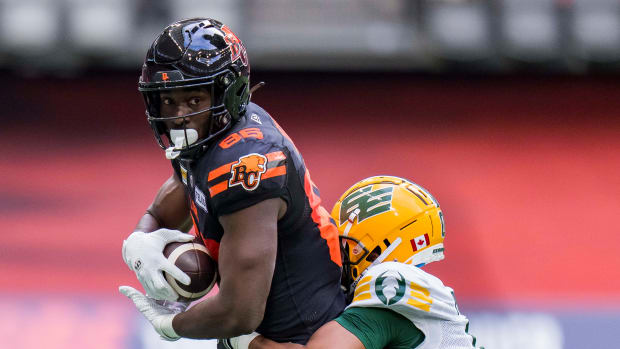 Jun 17, 2023; Vancouver, British Columbia, CAN; Edmonton Elks defensive back Loucheiz Purifoy (0) tackles BC Lions receiver Jevon Cottoy (86) in the second half at BC Place. BC won 22-0. Mandatory Credit: Bob Frid-USA TODAY Sports  