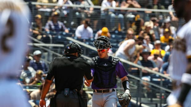Colorado Rockies catcher Brian Serven (6) greets the umpire as he walks up to home plate during a game at Petco Park in San Diego, Calif., Saturday, June 11, 2022.