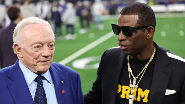 Nov 30, 2023; Arlington, Texas, USA; Colorado Buffaloes head coach Deion Sanders (right) talks with Dallas Cowboys owner Jerry Jones before the game against the Seattle Seahawks at AT&T Stadium