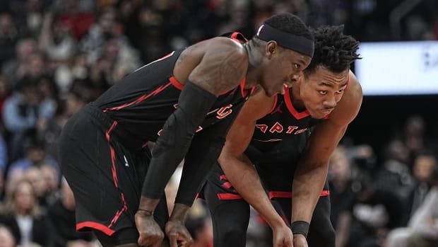 Jan 15, 2024; Toronto, Ontario, CAN; Toronto Raptors guard Dennis Schroder (left) and forward Scottie Barnes (right) talk during a break in the action against Boston Celtics during the second half at Scotiabank Arena.