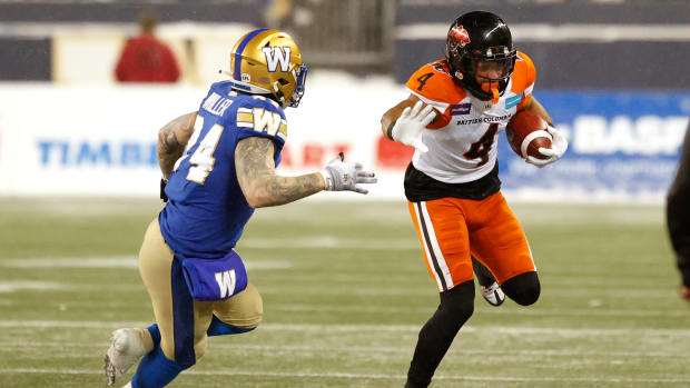 Nov 13, 2022; Winnipeg, Manitoba, CAN; Winnipeg Blue Bombers fullback Mike Miller (24) chases down BC Lions wide receiver Keon Hatcher (4) in the second period at Investors Group Field. Mandatory Credit: James Carey Lauder-USA TODAY Sports  