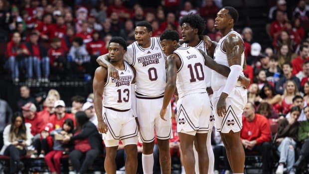 Dec 23, 2023; Newark, NY, USA; Mississippi State Bulldogs guard Josh Hubbard (13) and forward D.J. Jeffries (0) and Bulldogs guard Dashawn Davis (10) huddle with teammates during the first half against the Rutgers Scarlet Knights at Prudential Center. Mandatory Credit: Vincent Carchietta-USA TODAY Sports
