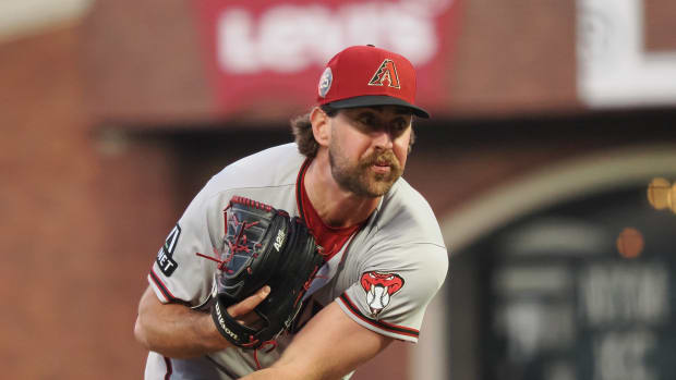 Aug 2, 2023; San Francisco, California, USA; Arizona Diamondbacks relief pitcher Tyler Gilbert (49) pitches the ball against the San Francisco Giants during the sixth inning at Oracle Park. Mandatory Credit: Kelley L Cox-USA TODAY Sports 
