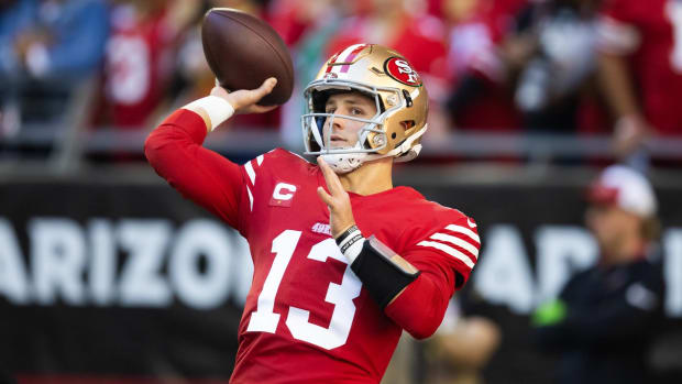 San Francisco 49ers quarterback Brock Purdy throws a ball in warmups before a game.