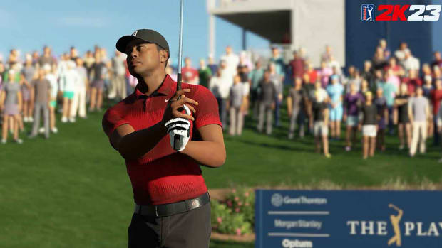 Tiger Woods swings in a screenshot from the PGA Tour 2K23 video game.