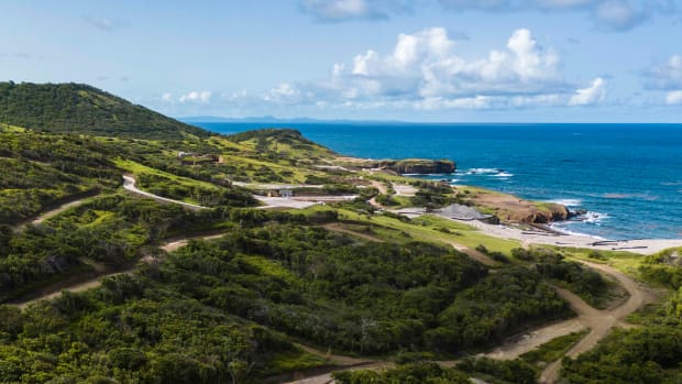 Cabot Saint Lucia and its golf course, bordering the blue waters of the Caribbean Sea.