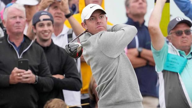 Rory McIlroy watches a tee shot at the 2022 British Open.