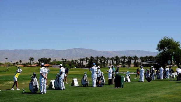 Players are shown on the driving range at a 2017 LPGA Tour event.