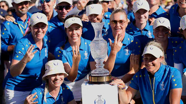 Europe's Solheim Cup team members pose with the trophy after winning in Finca Cortesin, near Casares, southern Spain, Sunday, Sept. 24, 2023.