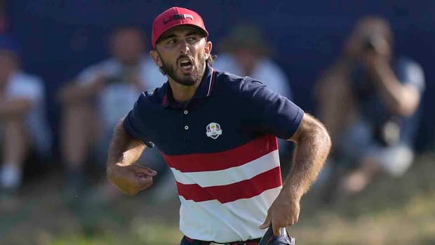 Max Homa celebrates as he wins his singles match 1 up on the 18th green at the 2023 Ryder Cup.