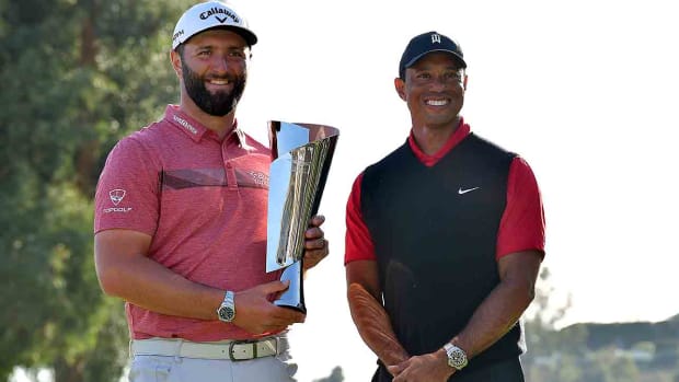 Genesis Invitational winner Jon Rahm and tournament host Tiger Woods after the conclusion of the 2023 event.