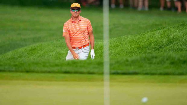 Rickie Fowler watches a shot at the 2023 Travelers Championship.