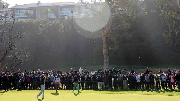 Tiger Woods hits from the fairway at Riviera Country Club at the 2020 Genesis Invitational.