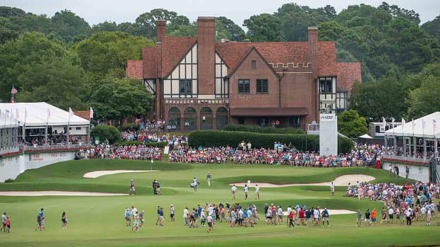 The East Lake clubhouse surrounds the 18th green during the final round of the 2019 Tour Championship.