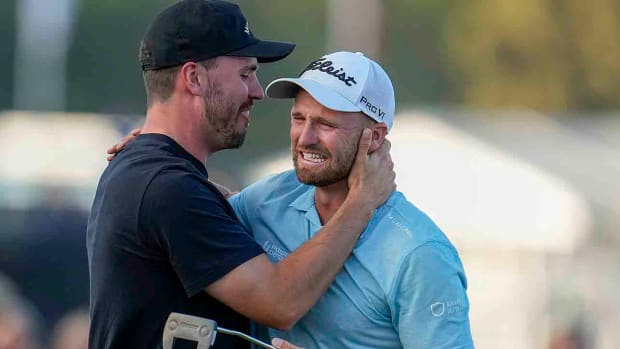 Wyndham Clark is emotional on the 18th green with his caddie after winning the 2023 U.S. Open.