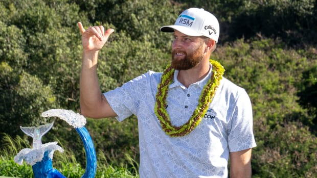  Chris Kirk celebrates with the trophy after winning during the final round of The Sentry golf tournament at Kapalua Golf - The Plantation Course.
