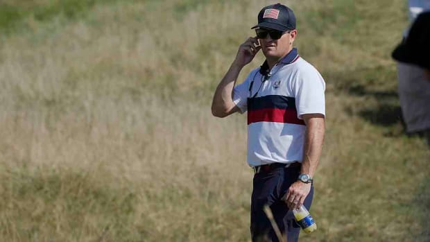 U.S. Captain Zach Johnson watches his players from the 4th fairway during their afternoon fourballs matches at the Ryder Cup golf tournament at the Marco Simone Golf Club in Italy, Saturday, Sept. 30, 2023.