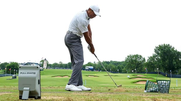 Tiger Woods works on the range with a Full Swing launch monitor at the 2022 PGA Championship at Southern Hills.