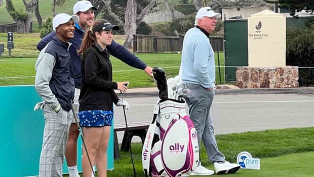 PGA Tour Champions pro Mark O'Meara watches play alongside First Tee juniors.