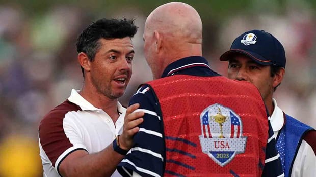 Team Europe's Rory McIlroy argues with Joe LaCava, caddie of USA's Patrick Cantlay on the 18th during the fourballs on Day 2 of the 2023 Ryder Cup at the Marco Simone Golf and Country Club, Rome, Italy.