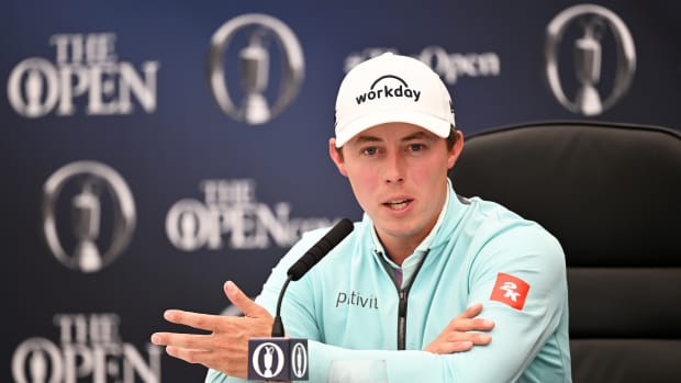 Matt Fitzpatrick of England looks on as they are interviewed prior to The 151st Open at Royal Liverpool Golf Club on July 17, 2023 in Hoylake, England.