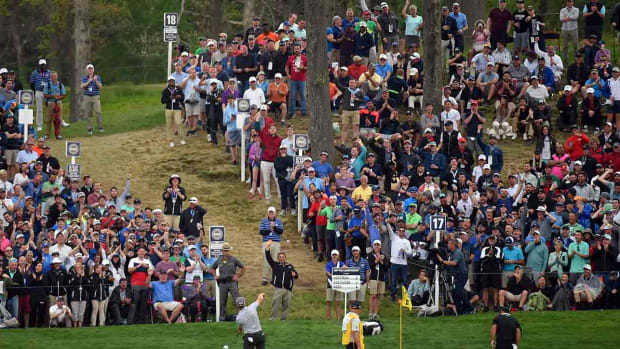 Charley Hoffman throws a ball to the crowd at the 2019 PGA Championship at Bethpage Black in New York.