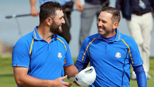 Team Europe player Jon Rahm celebrates teammate Sergio Garcia on the 17th green during day one foursome rounds for the 43rd Ryder Cup in 2021.