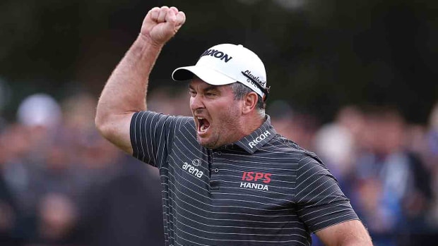 Ryan Fox of New Zealand celebrates as he holes the winning putt on the 18th green at the 2023 BMW PGA Championship.