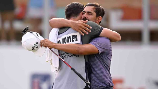 Erik van Rooyen hugs his caddie after winning the 2023 World Wide Technology Championship.