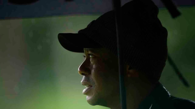 Tiger Woods is pictured under an umbrella at the 2023 Masters.