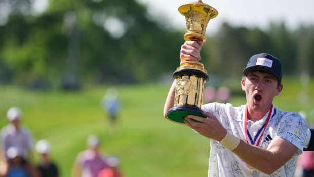 Nick Dunlap of the United States poses for a photo with the trophy after winning the 123rd U.S. Amateur Championship Final at Cherry Hills Country Club on August 20, 2023 in Cherry Hills Village, Colorado.