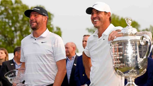 Michael Block reacts after being awarded the low PGA championship Club Professional bowl and Brooks Koepka reacts after winning the 2023 PGA Championship at Oak Hill Country Club.