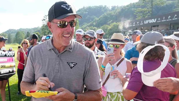 Phil Mickelson signs autographs after the first round of the 2023 LIV Golf event at The Greenbrier in West Virginia.