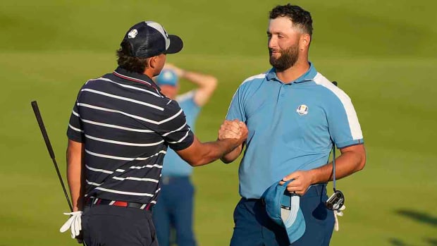 Europe's Jon Rahm shakes hands with United States' Brooks Koepka after the match was tied in their afternoon fourballs match at the 2023 Ryder Cup golf tournament at the Marco Simone Golf Club in Italy.