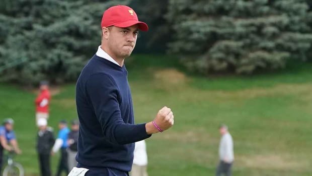 Justin Thomas pumps his fist after a holed putt in the 2017 Presidents Cup.