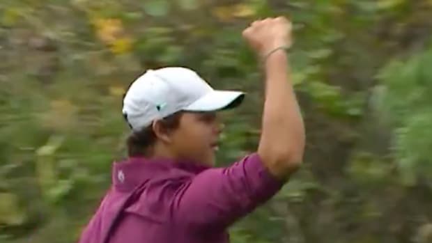 Charlie Woods fist pumps in celebration at the 2023 PNC Championship.